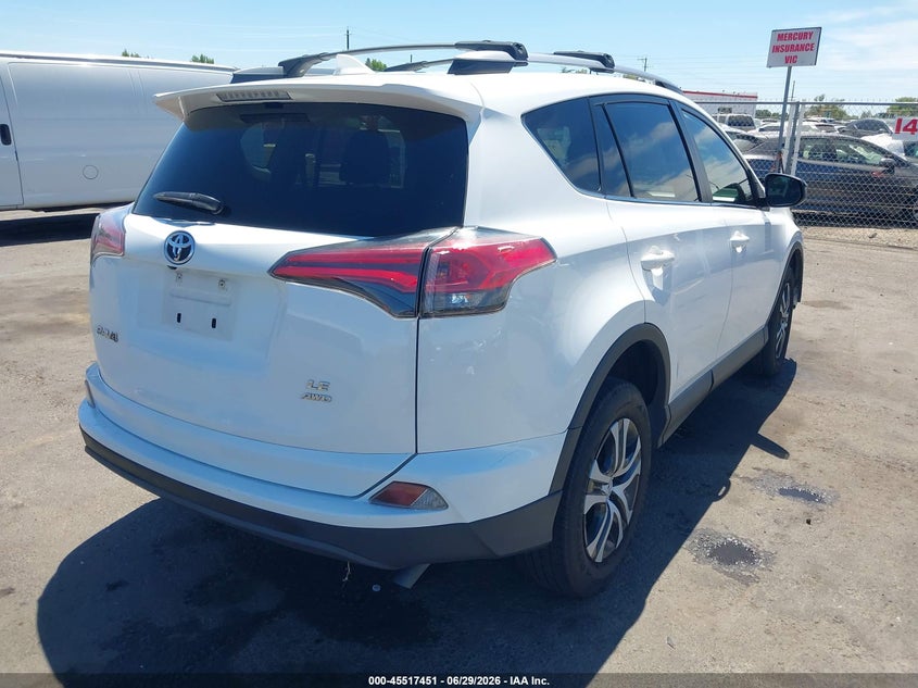 2018 Toyota Rav 4 VIN JTMBFREV3JD243425 IAAI salvage auction — EXTERIOR BURN, Salvage Title, sold $1,050 on 2026-07-22 (photo 4)
