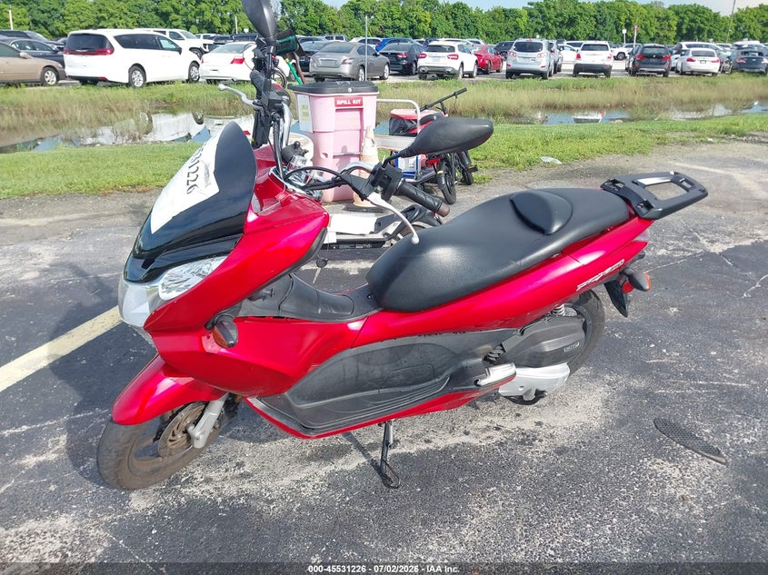 2013 Honda Pcx VIN MLHKF1216D5001873 IAAI salvage auction — SIDE, Rebuildable (Florida), sold $75 on 2026-07-28 (photo 2)