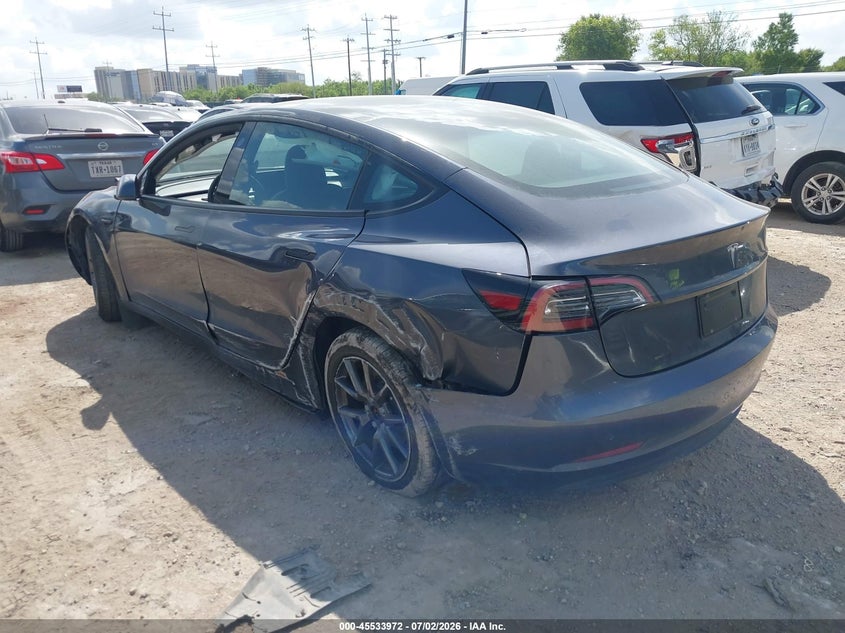 2023 Tesla Model 3 VIN 5YJ3E1EAXPF615947 IAAI salvage auction — SIDE, Original (Texas), sold $7,600 on 2026-07-29 (photo 3)