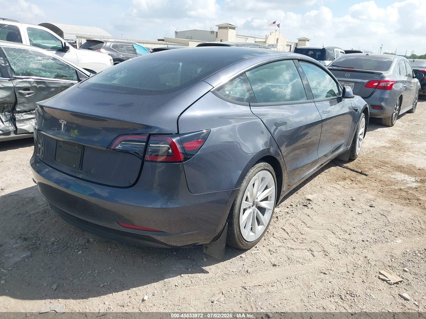 2023 Tesla Model 3 VIN 5YJ3E1EAXPF615947 IAAI salvage auction — SIDE, Original (Texas), sold $7,600 on 2026-07-29 (photo 4)