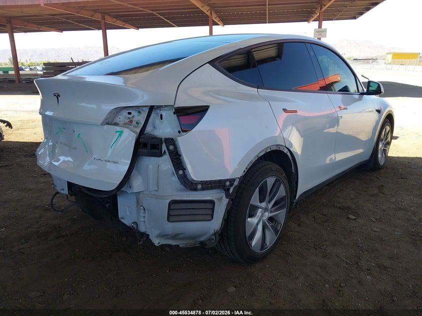 2023 Tesla Model y VIN 7SAYGDEE2PA093190 IAAI salvage auction — REAR END, Salvage (Arizona), sold $13,000 on 2026-07-16 (photo 4)
