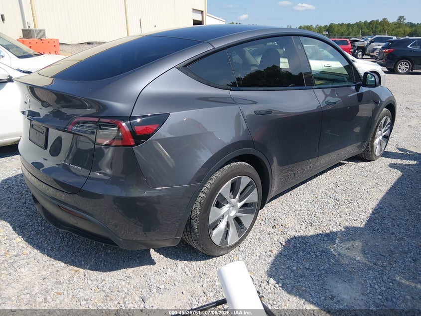2023 Tesla Model y VIN 7SAYGAEE9PF788283 IAAI salvage auction — WATER/FLOOD, Flood (Mississippi), sold $14,500 on 2026-08-27 (photo 4)