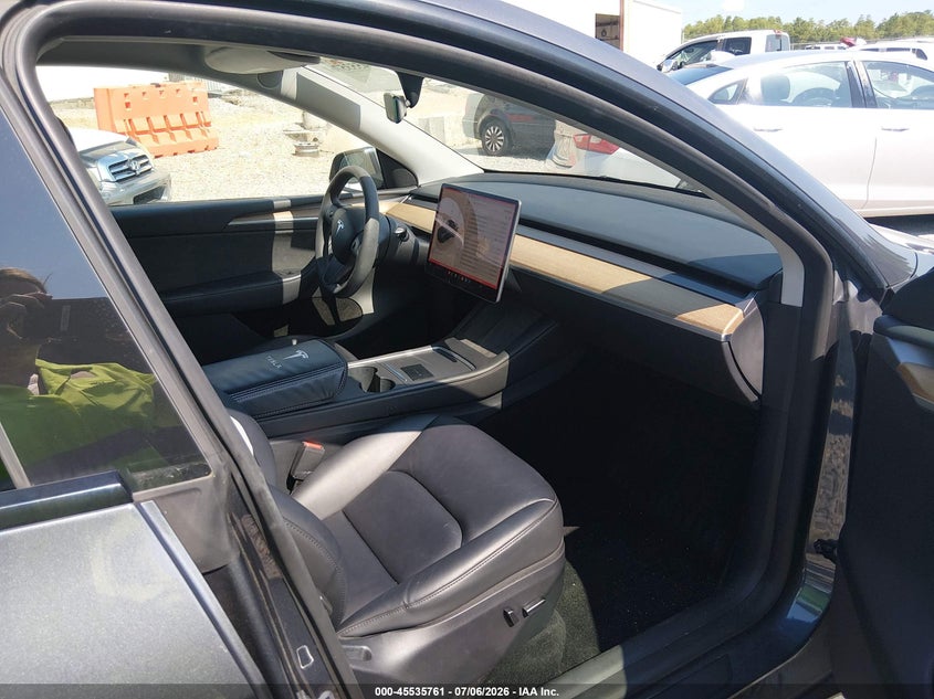 2023 Tesla Model y VIN 7SAYGAEE9PF788283 IAAI salvage auction — WATER/FLOOD, Flood (Mississippi), sold $14,500 on 2026-08-27 (photo 5)