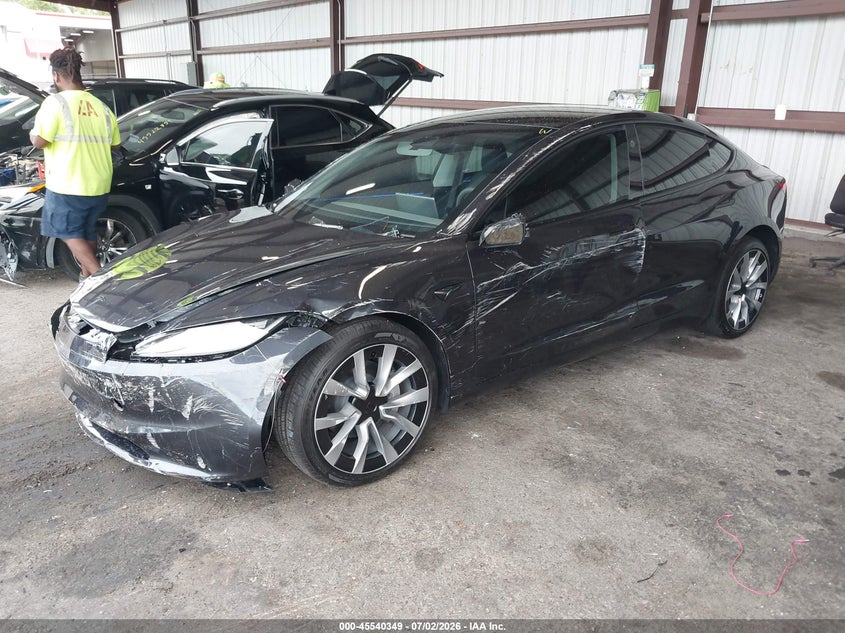 2026 Tesla Model 3 VIN 5YJ3E1EA0TF144286 IAAI salvage auction — SIDE, Rebuildable (Florida), sold $9,100 on 2026-07-30 (photo 2)