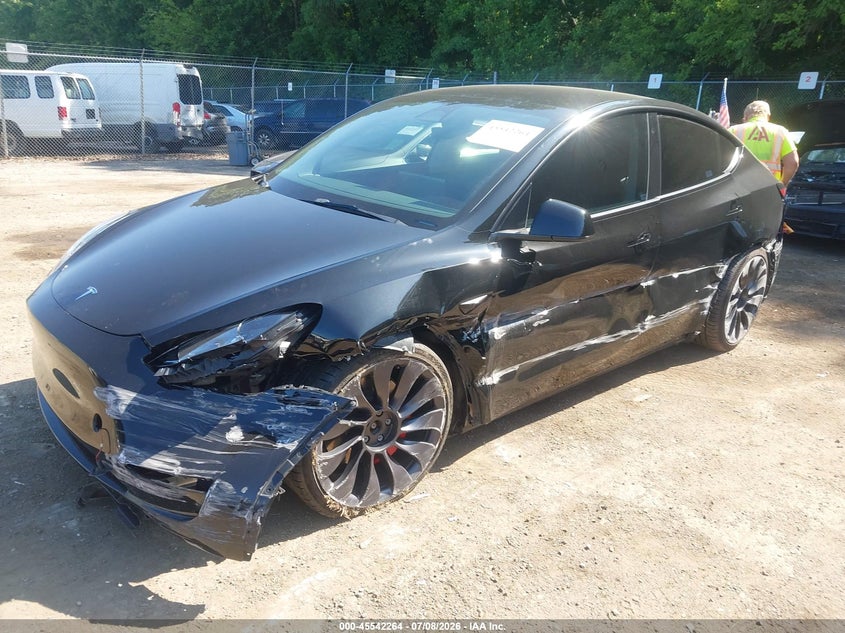 2023 Tesla Model y VIN 7SAYGDEF1PF698720 IAAI salvage auction — SIDE, Salvage Title, sold $8,400 on 2026-08-02 (photo 2)