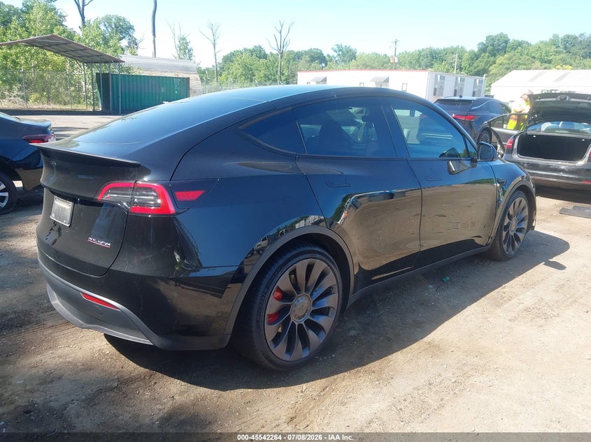 2023 Tesla Model y VIN 7SAYGDEF1PF698720 IAAI salvage auction — SIDE, Salvage Title, sold $8,400 on 2026-08-02 (photo 4)