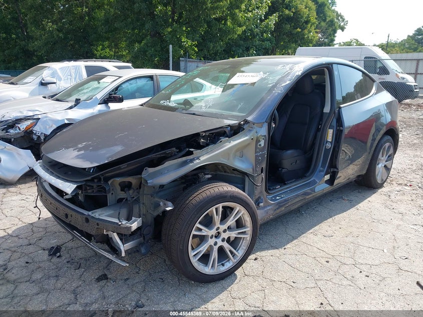 2023 Tesla Model y VIN 7SAYGDEE4PF616244 IAAI salvage auction — SIDE, Salvage Title, sold $11,500 on 2026-08-19 (photo 2)