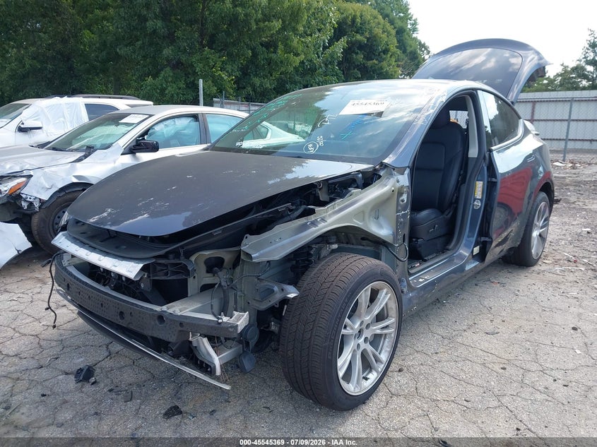 2023 Tesla Model y VIN 7SAYGDEE4PF616244 IAAI salvage auction — SIDE, Salvage Title, sold $11,500 on 2026-08-19 (photo 6)