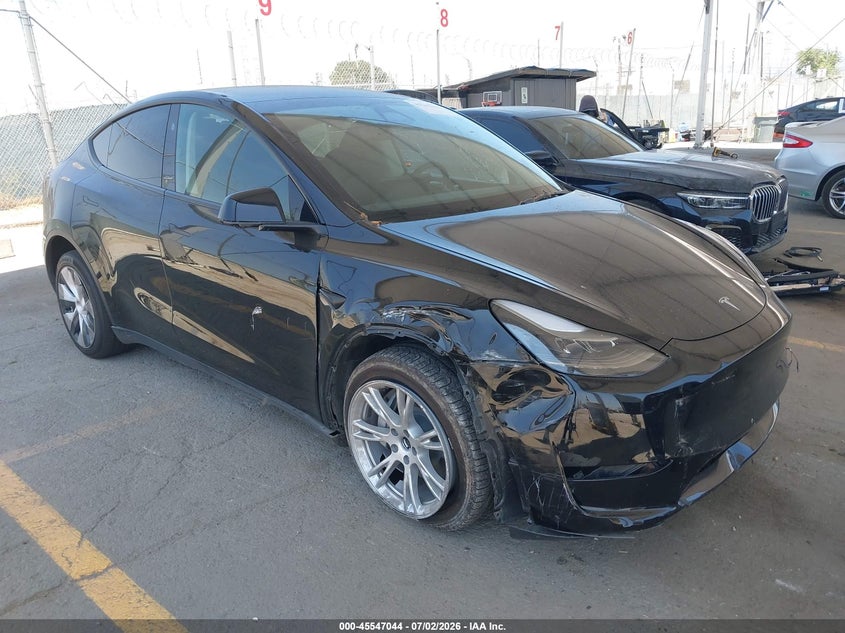 2023 Tesla Model y VIN 7SAYGDEEXPF883291 IAAI salvage auction — LEFT SIDE, Salvage Title, sold $9,000 on 2026-07-29 (photo 1)