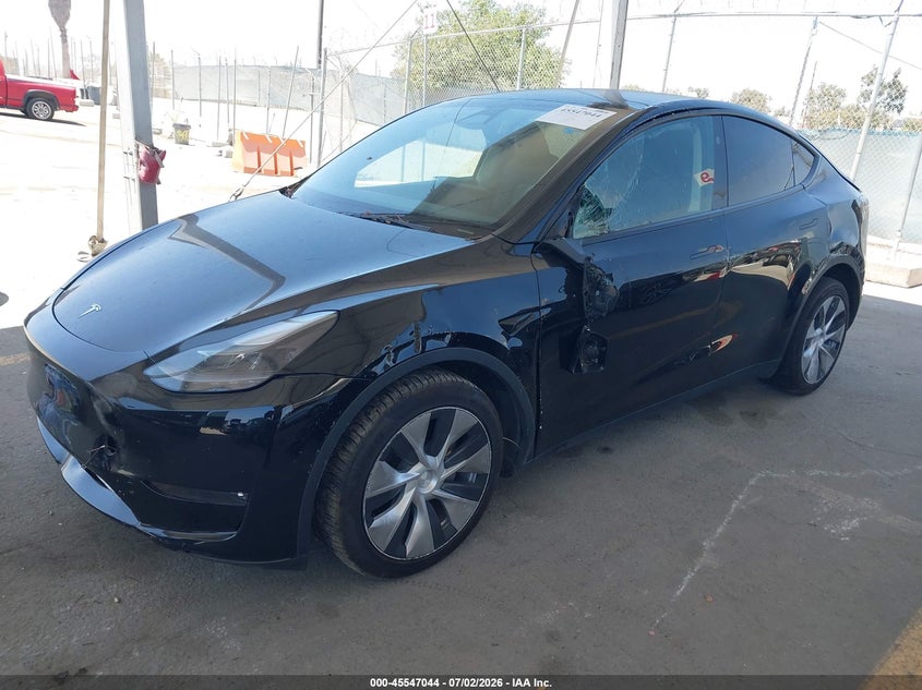 2023 Tesla Model y VIN 7SAYGDEEXPF883291 IAAI salvage auction — LEFT SIDE, Salvage Title, sold $9,000 on 2026-07-29 (photo 2)