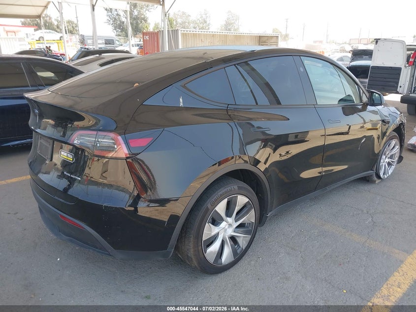 2023 Tesla Model y VIN 7SAYGDEEXPF883291 IAAI salvage auction — LEFT SIDE, Salvage Title, sold $9,000 on 2026-07-29 (photo 4)