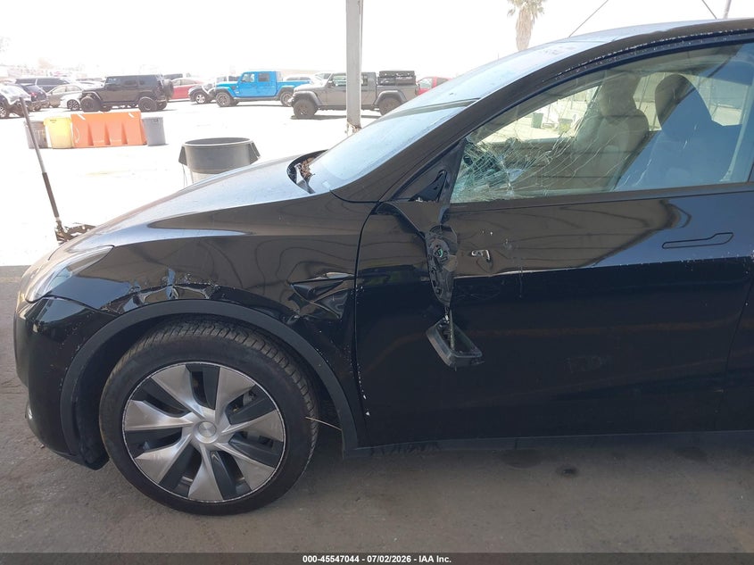 2023 Tesla Model y VIN 7SAYGDEEXPF883291 IAAI salvage auction — LEFT SIDE, Salvage Title, sold $9,000 on 2026-07-29 (photo 6)