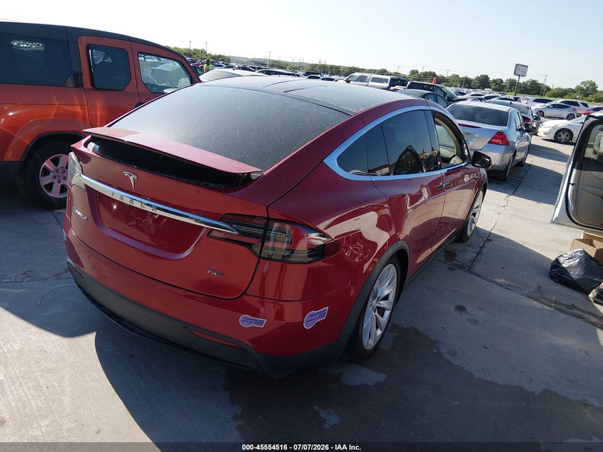 2018 Tesla Model x VIN 5YJXCAE21JF142026 IAAI salvage auction — ALL OVER, Rebuilt (Indiana), sold $2,700 on 2026-07-27 (photo 4)