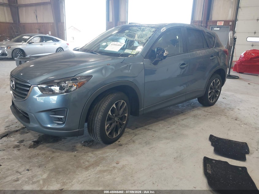 2016 Mazda Cx-5 VIN JM3KE4DY2G0713906 IAAI salvage auction — STORM DAMAGE, Salvage Title, sold $25 on 2026-07-29 (photo 2)