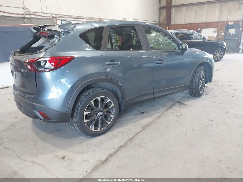 2016 Mazda Cx-5 VIN JM3KE4DY2G0713906 IAAI salvage auction — STORM DAMAGE, Salvage Title, sold $25 on 2026-07-29 (photo 4)