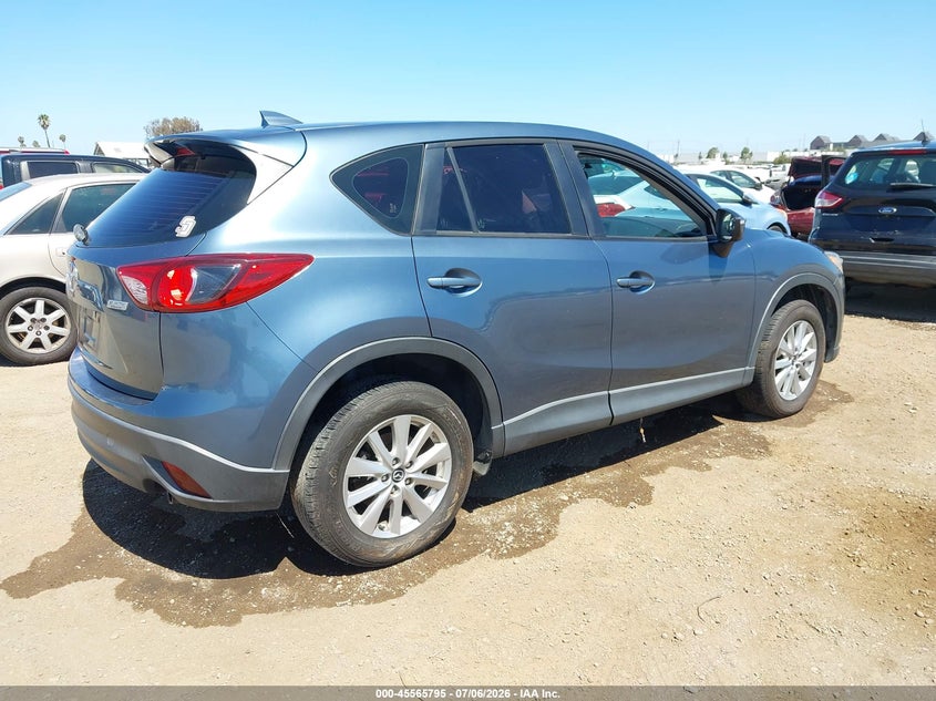 2016 Mazda Cx-5 VIN JM3KE2BYXG0763766 IAAI salvage auction — NORMAL WEAR, Salvage Title, sold $1,400 on 2026-07-13 (photo 4)