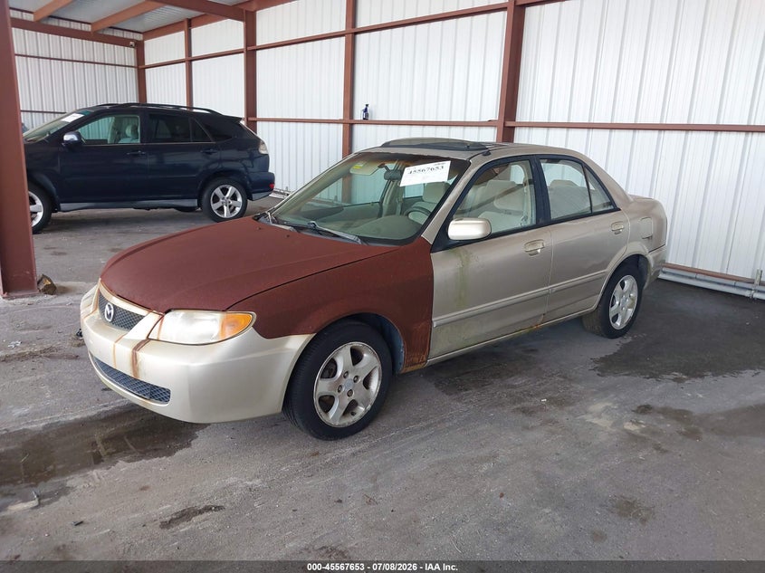 2002 Mazda Protege VIN JM1BJ225821588592 IAAI salvage auction — NORMAL WEAR, Clear (Florida), sold $25 on 2026-07-15 (photo 2)