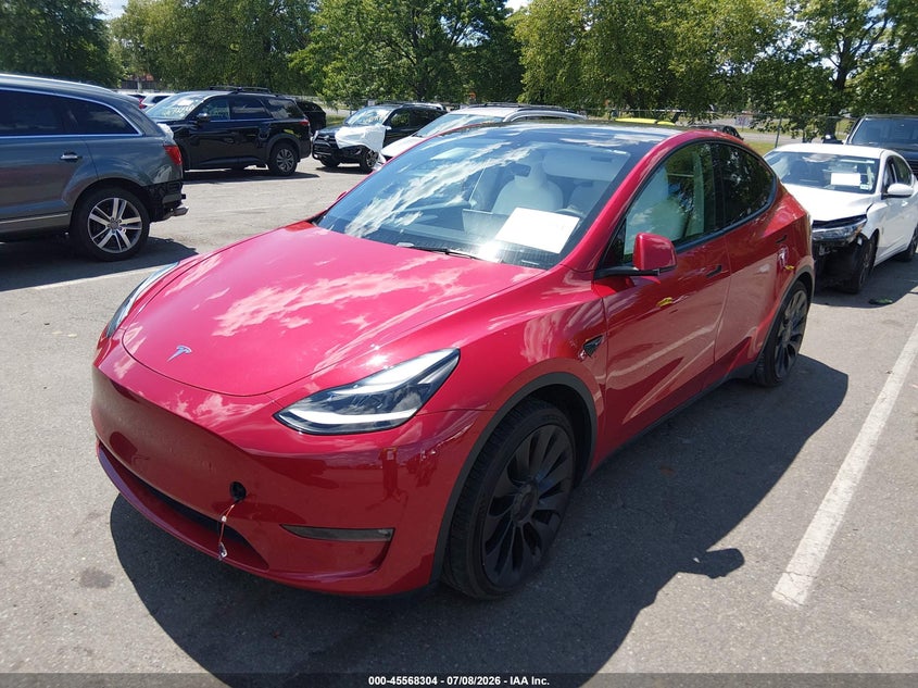 2023 Tesla Model y VIN 7SAYGDEF3PF624814 IAAI salvage auction — SIDE, Salvage Title, sold $12,400 on 2026-08-29 (photo 2)