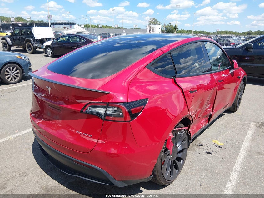 2023 Tesla Model y VIN 7SAYGDEF3PF624814 IAAI salvage auction — SIDE, Salvage Title, sold $12,400 on 2026-08-29 (photo 4)