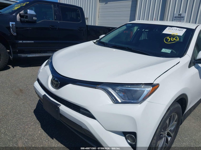 2018 Toyota Rav 4 VIN JTMRJREV0JD256954 IAAI salvage auction — NORMAL WEAR, Salvage Title, sold $2,350 on 2026-07-28 (photo 6)