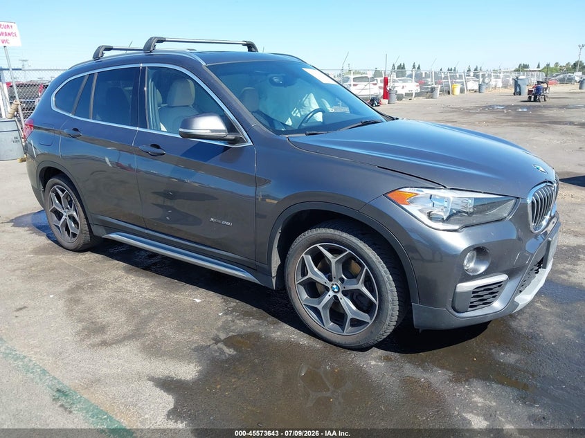 2018 BMW X1 VIN WBXHT3C33J5F91906 IAAI salvage auction — LEFT SIDE, Salvage Title, sold $2,350 on 2026-07-29 (photo 1)