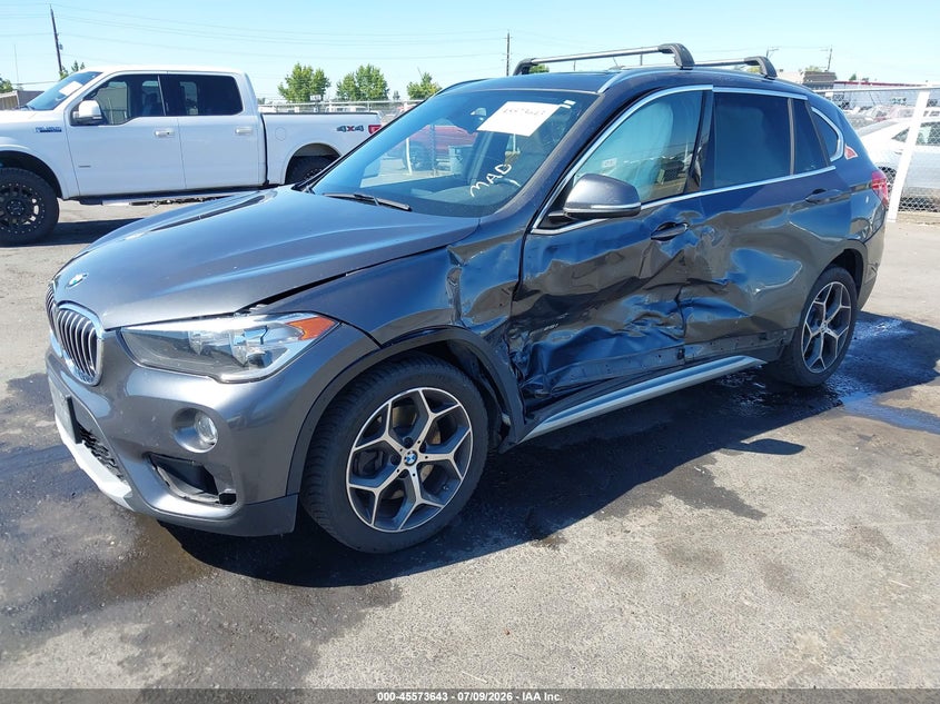 2018 BMW X1 VIN WBXHT3C33J5F91906 IAAI salvage auction — LEFT SIDE, Salvage Title, sold $2,350 on 2026-07-29 (photo 2)