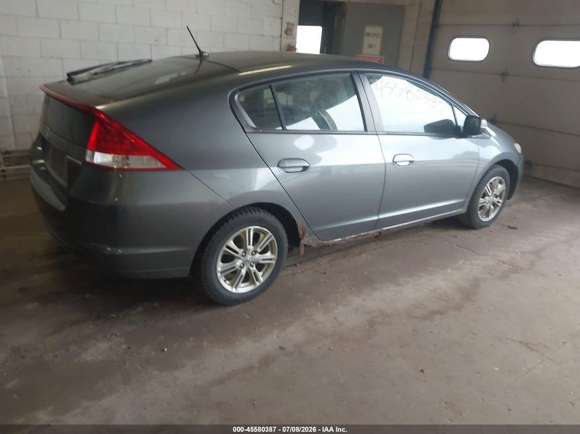 2010 Honda Insight VIN JHMZE2H7XAS017141 IAAI salvage auction — NORMAL WEAR, Clear (Minnesota), sold $950 on 2026-07-15 (photo 4)