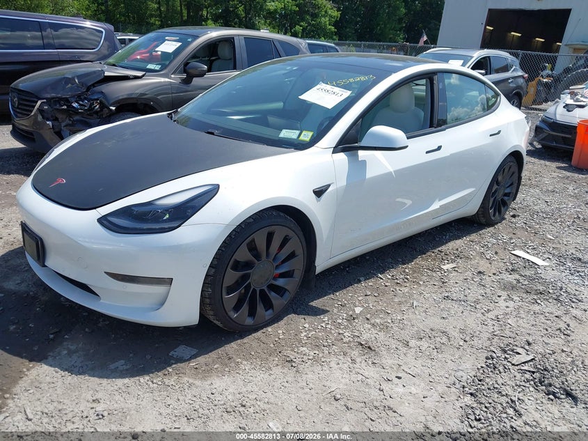 2021 Tesla Model 3 VIN 5YJ3E1EC8MF973335 IAAI salvage auction — RIGHT FRONT, Salvage Title, sold $1,300 on 2026-07-30 (photo 2)