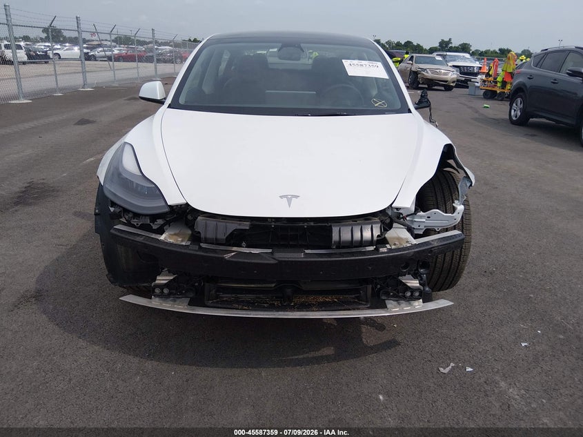2023 Tesla Model 3 VIN 5YJ3E1EA1PF511346 IAAI salvage auction — FRONT & REAR, Salvage Title, sold $8,600 on 2026-10-03 (photo 6)