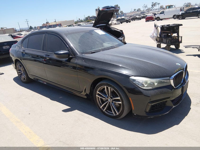 2017 BMW 7er VIN WBA7E2C55HG739285 IAAI salvage auction — LEFT SIDE, Salvage Title, sold $5,000 on 2026-08-12 (photo 1)