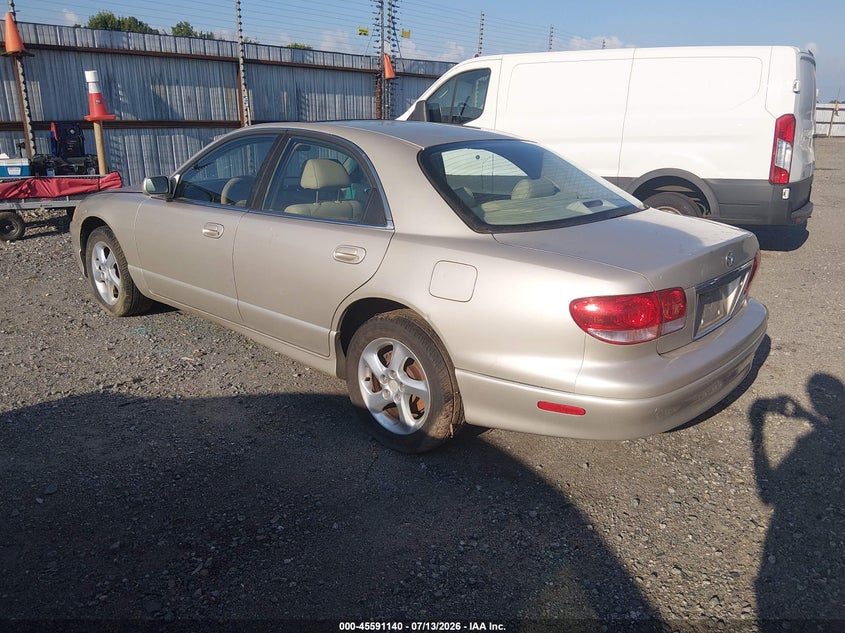 2002 Mazda Millenia VIN JM1TA221X21719037 IAAI salvage auction — NORMAL WEAR, Clear (Arkansas), sold $100 on 2026-07-29 (photo 3)
