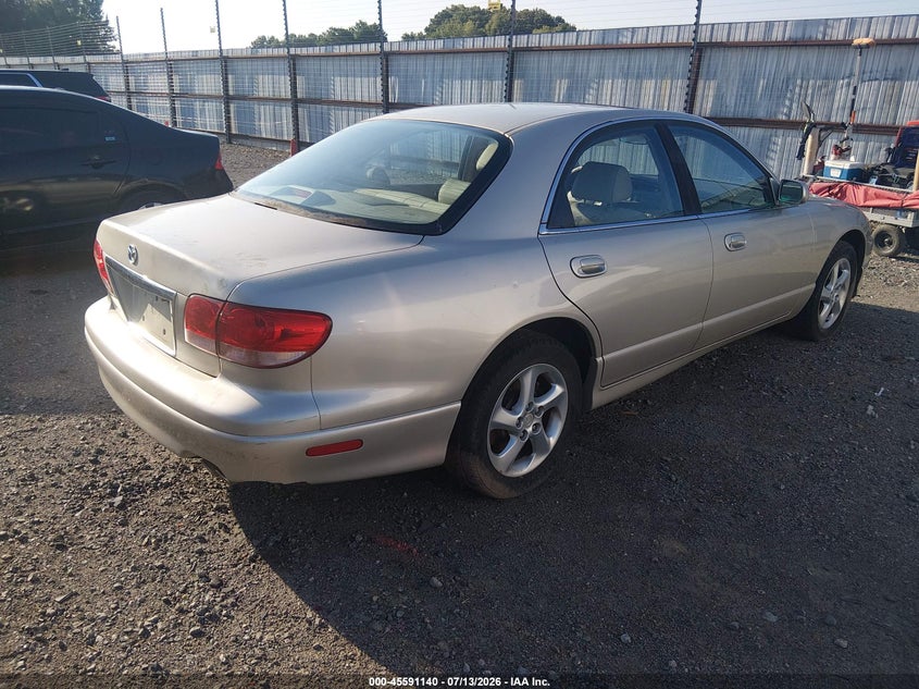 2002 Mazda Millenia VIN JM1TA221X21719037 IAAI salvage auction — NORMAL WEAR, Clear (Arkansas), sold $100 on 2026-07-29 (photo 4)