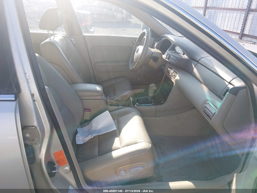 2002 Mazda Millenia VIN JM1TA221X21719037 IAAI salvage auction — NORMAL WEAR, Clear (Arkansas), sold $100 on 2026-07-29 (photo 5)