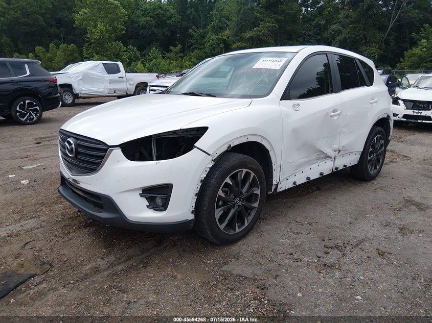 2016 Mazda Cx-5 VIN JM3KE2DY9G0771886 IAAI salvage auction — SIDE, Salvage Title, sold $3,250 on 2026-08-01 (photo 2)