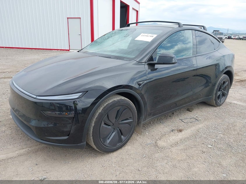 2026 Tesla Model y VIN 7SAYGDEE8TF628908 IAAI salvage auction — SIDE, Salvage Title, sold $29,500 on 2026-10-03 (photo 2)