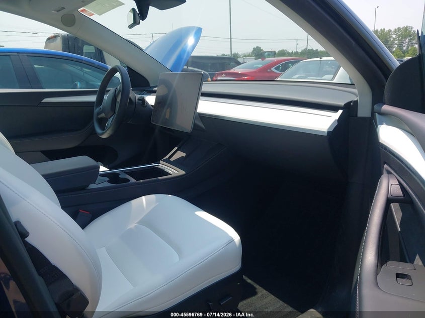 2023 Tesla Model y VIN 7SAYGAEE6PF779816 IAAI salvage auction — HAIL, Salvage (Ohio), sold $8,800 on 2026-08-25 (photo 5)