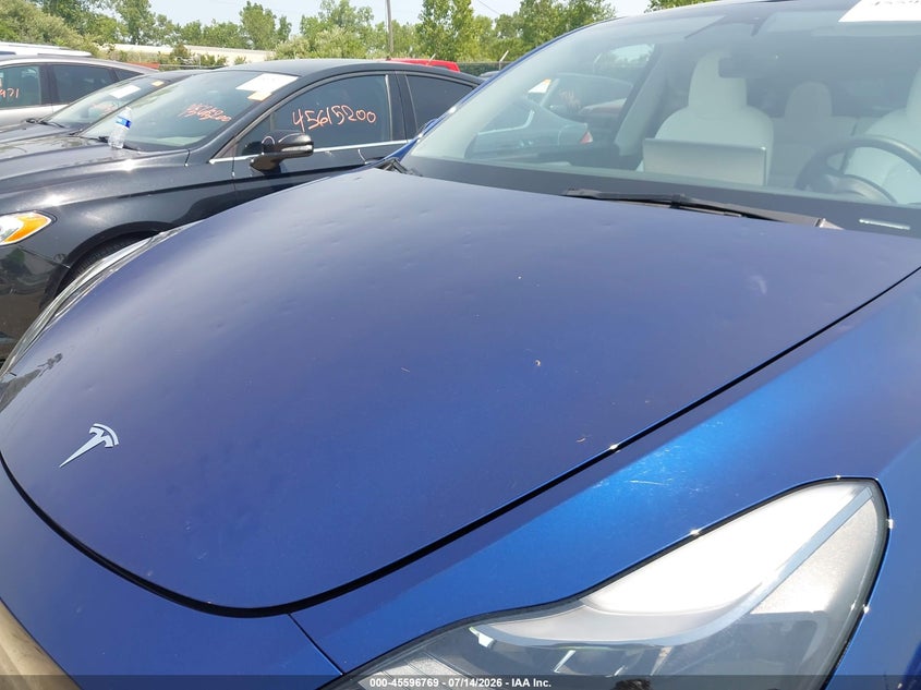 2023 Tesla Model y VIN 7SAYGAEE6PF779816 IAAI salvage auction — HAIL, Salvage (Ohio), sold $8,800 on 2026-08-25 (photo 6)