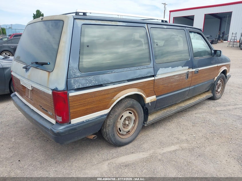 1990 Plymouth Grand voyager VIN 1P4GH54R5LX247972 IAAI salvage auction — NORMAL WEAR, Clear (Montana), sold $50 on 2026-07-22 (photo 4)