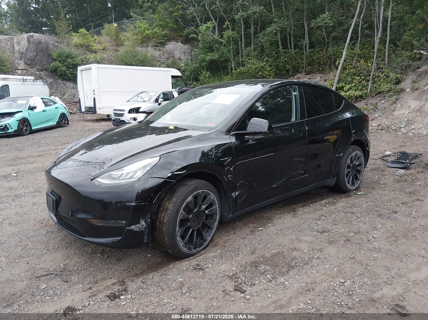 2023 Tesla Model y VIN 7SAYGDEE4PA050972 IAAI salvage auction — RIGHT FRONT, Wait Title, sold $11,700 on 2026-09-01 (photo 2)