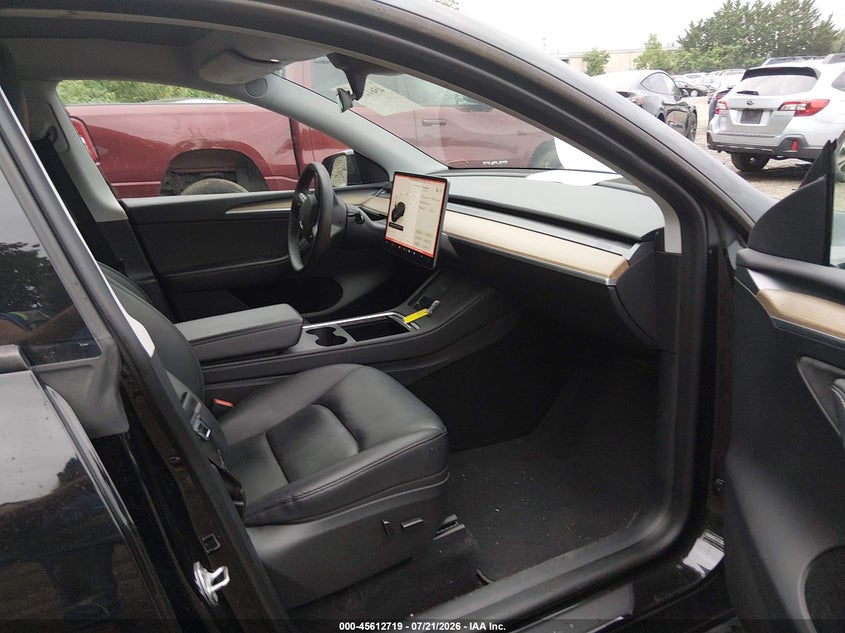 2023 Tesla Model y VIN 7SAYGDEE4PA050972 IAAI salvage auction — RIGHT FRONT, Wait Title, sold $11,700 on 2026-09-01 (photo 5)