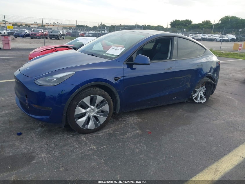 2023 Tesla Model y VIN 7SAYGDEE0PA206991 IAAI salvage auction — LEFT SIDE, Salvage Title, sold $11,250 on 2026-09-05 (photo 2)