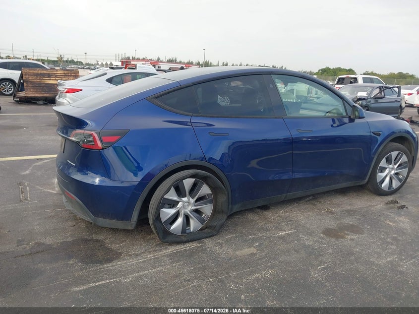 2023 Tesla Model y VIN 7SAYGDEE0PA206991 IAAI salvage auction — LEFT SIDE, Salvage Title, sold $11,250 on 2026-09-05 (photo 4)