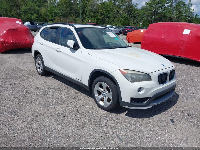 2015 BMW X1 VIN WBAVM1C53FVW57696 IAAI salvage auction — Burn Engine, Rebuildable (Florida), sold $250 on 2026-09-26 (photo 1)
