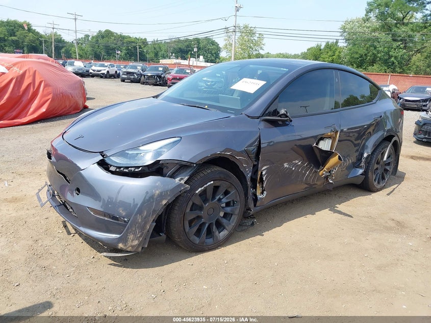2023 Tesla Model y VIN 7SAYGDEE4PF861741 IAAI salvage auction — SIDE, Salvage (Idaho), sold $10,200 on 2026-08-02 (photo 2)