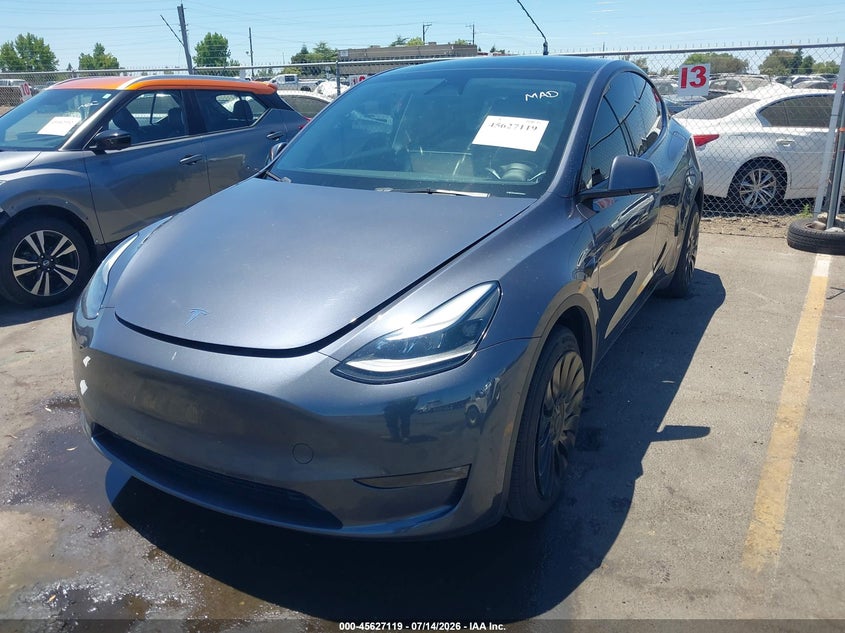 2023 Tesla Model y VIN 7SAYGDEE2PF840550 IAAI salvage auction — REAR END, Wait Title, sold $13,200 on 2026-08-31 (photo 2)