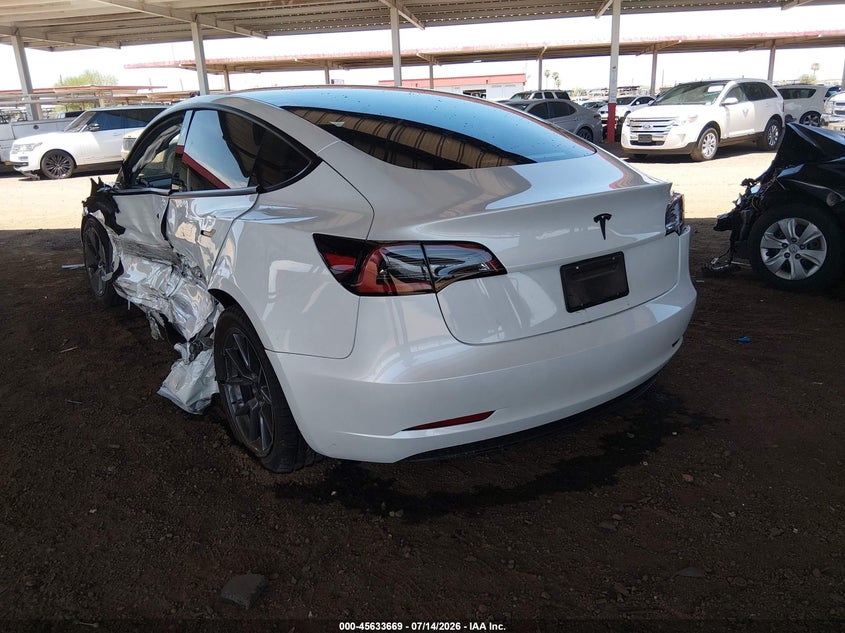 2023 Tesla Model 3 VIN 5YJ3E1EA7PF560230 IAAI salvage auction — SIDE, Salvage Title, sold $4,600 on 2026-07-29 (photo 3)