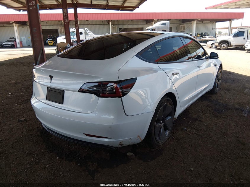 2023 Tesla Model 3 VIN 5YJ3E1EA7PF560230 IAAI salvage auction — SIDE, Salvage Title, sold $4,600 on 2026-07-29 (photo 4)
