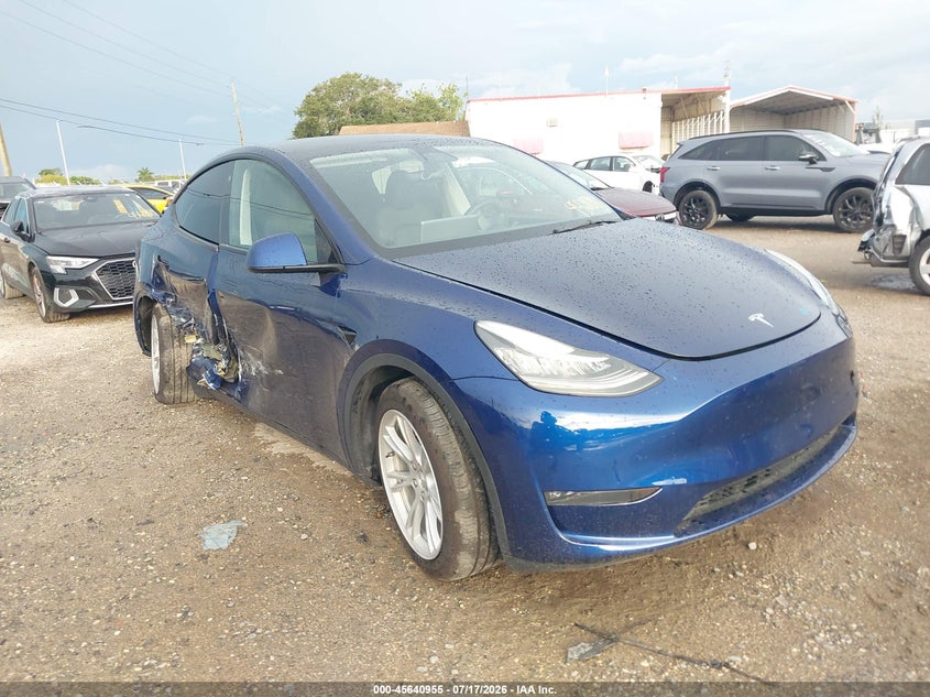 2023 Tesla Model y VIN 7SAYGDEE0PA060317 — IAAI salvage auction photo