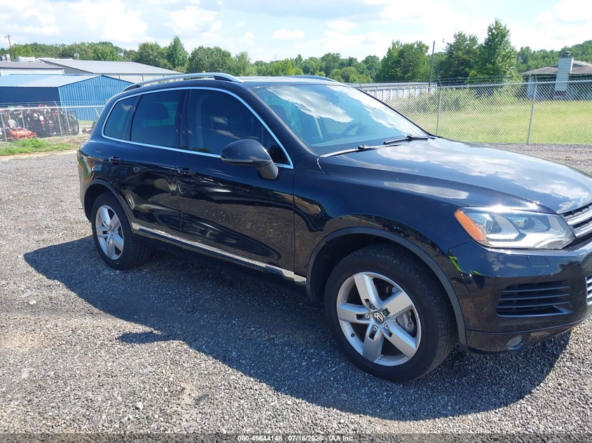 2014 Volkswagen Touareg VIN WVGEP9BP8ED001134 IAAI salvage auction — NORMAL WEAR, Salvage Title, sold $375 on 2026-07-21 (photo 1)