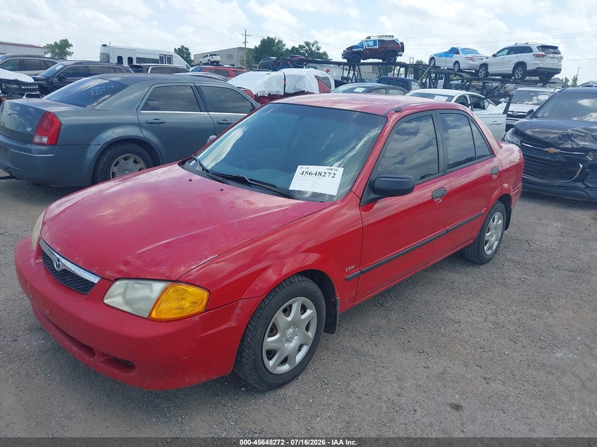 2000 Mazda Protege VIN JM1BJ2225Y0246487 IAAI salvage auction — NORMAL WEAR, Clear (Oklahoma), sold $25 on 2026-07-21 (photo 2)